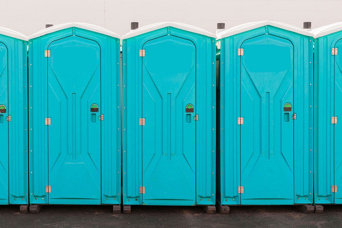 Industrial portable restroom units at a plant in Oceanside, California